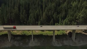 Stock Video Flyover Of Tall Mountain Highway Along River Live Wallpaper For PC