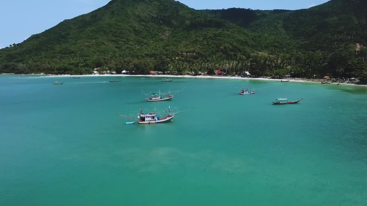 Download Stock Video Flying Over The Water Of A Beach With Many Boats Live Wallpaper For PC