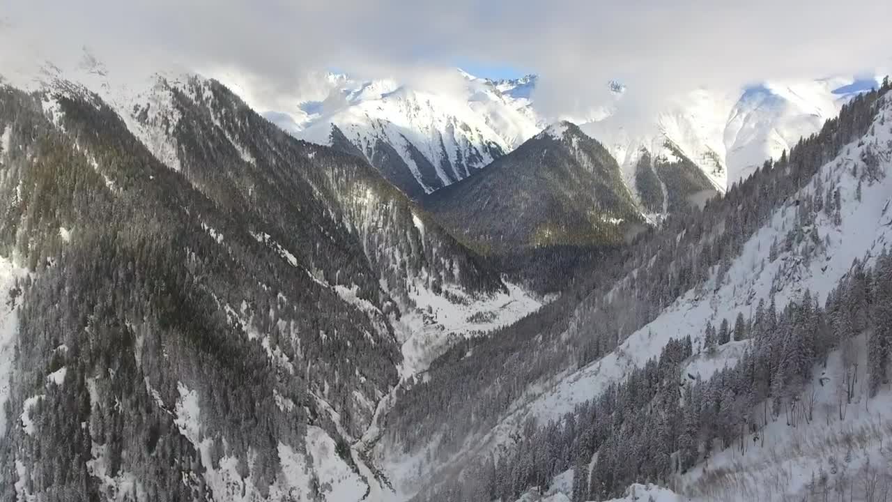 Download Stock Video Flying Over The Snowy Mountains Live Wallpaper For PC