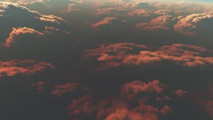 Stock Video Flying Over The Clouds Illuminated By The Sunset Live Wallpaper For PC