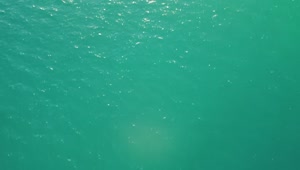 Stock Video Flying Over The Azure Blue Water Of A Beach Live Wallpaper For PC
