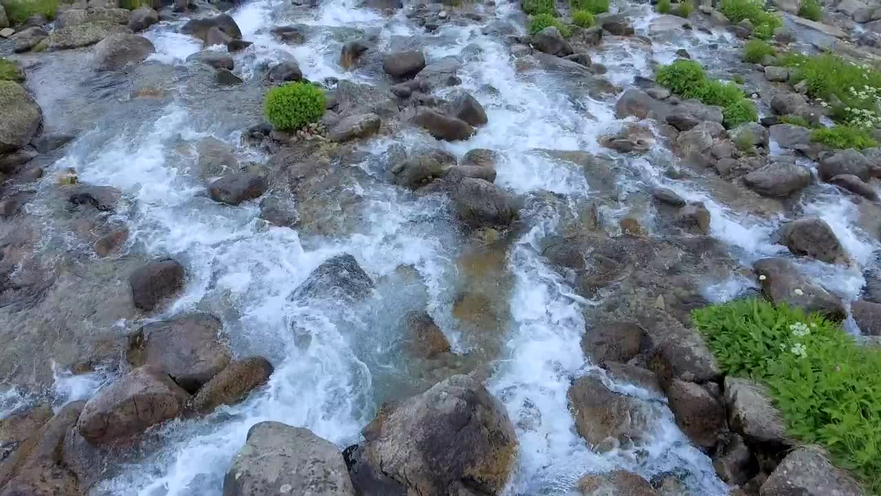 Download Stock Video Flying Over A Stream With Rocks Live Wallpaper For PC