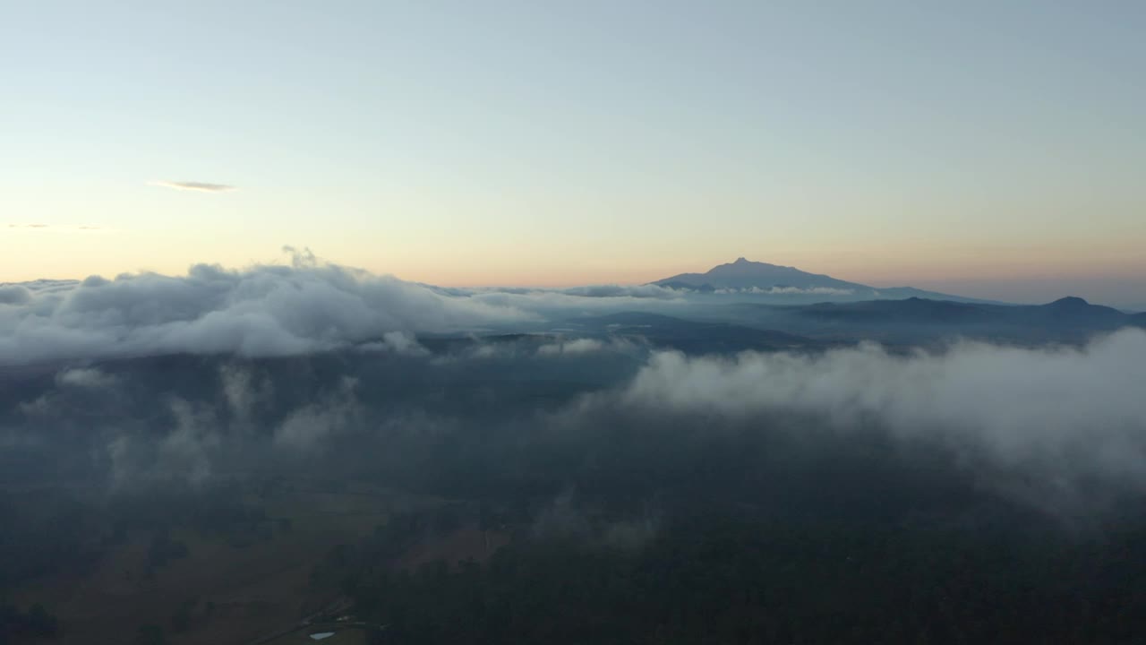 Download Stock Video Flying Over A Mountainous Landscape Covered With Clouds Live Wallpaper For PC