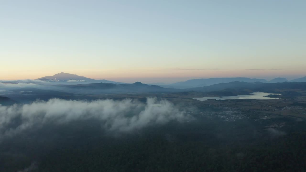 Download Stock Video Flying Over A Landscape With Mountains During Sunset Live Wallpaper For PC