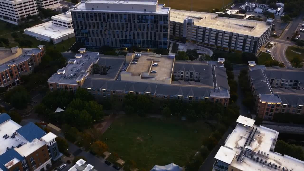 Download Stock Video Flying Over A City With Buildings And A Huge Park Live Wallpaper For PC