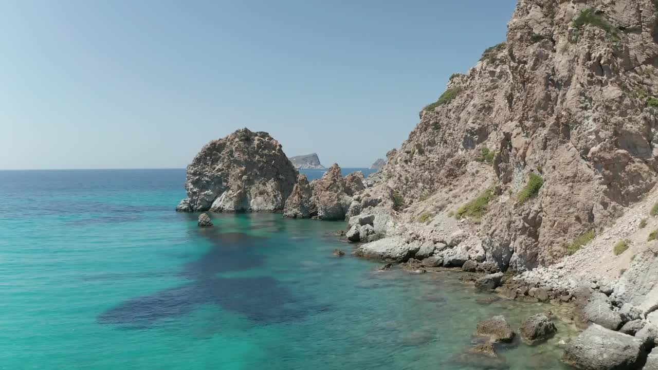 Download Stock Video Flying On The Rocky Shore Of A Turquoise Blue Sea Live Wallpaper For PC