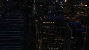 Stock Video Flying Between The Skyscrapers Of A City At Night Live Wallpaper For PC
