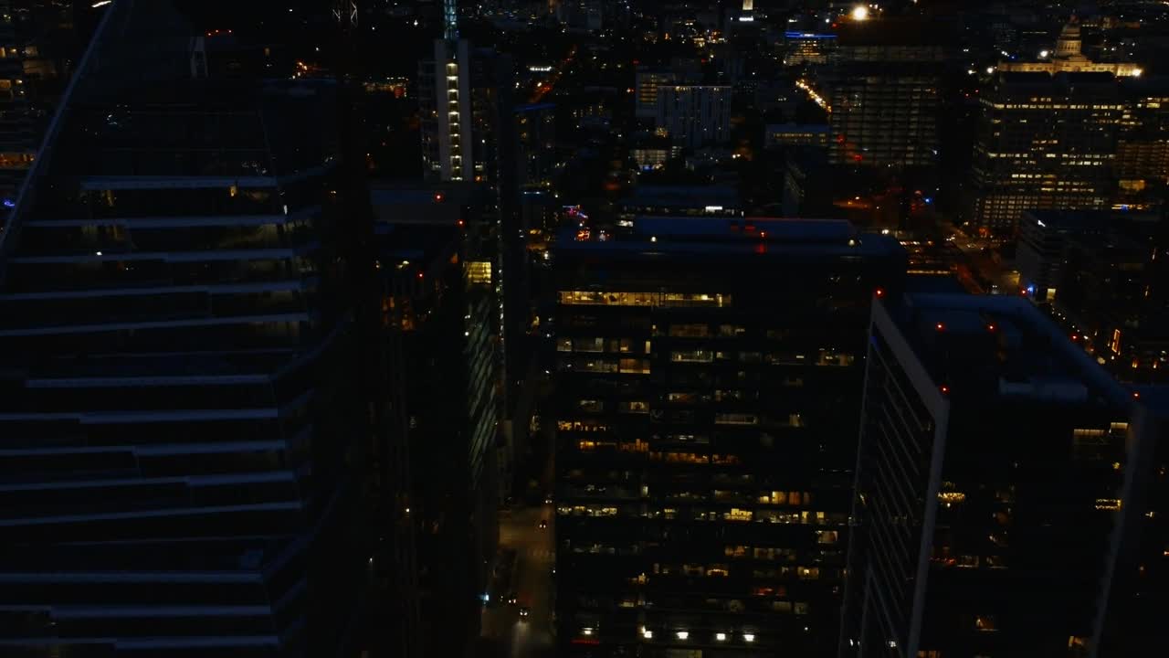 Download Stock Video Flying Between The Skyscrapers Of A City At Night Live Wallpaper For PC