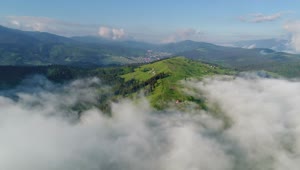 Stock Video Flying Above The Clouds Of A Green Valley Live Wallpaper For PC