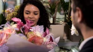 Stock Video Florist Handing A Bundle Of Flowers To A Customer Live Wallpaper For PC