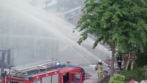 Stock Video Firefighters On The Street Shooting Water With Their Hoses Live Wallpaper For PC
