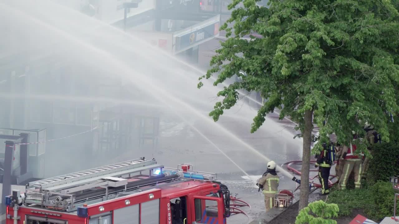 Download Stock Video Firefighters On The Street Shooting Water With Their Hoses Live Wallpaper For PC