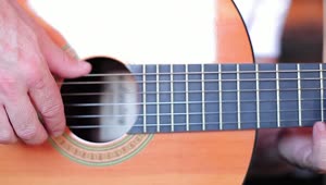 Stock Video Fingers Of A Man Playing The Strings Of A Guitar Live Wallpaper For PC