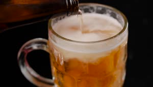 Stock Video Filling A Mug With Beer On A Dark Background Live Wallpaper For PC