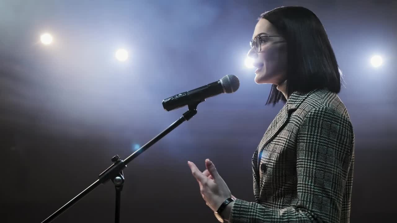Download Stock Video Female Speaker Giving A Talk On Stage Live Wallpaper For PC