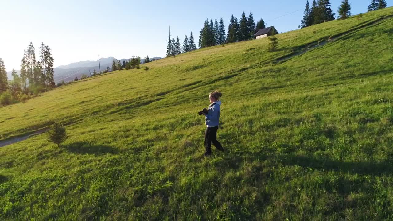Download Stock Video Female Photographer Walking Down A Hill And Taking Photos Live Wallpaper For PC
