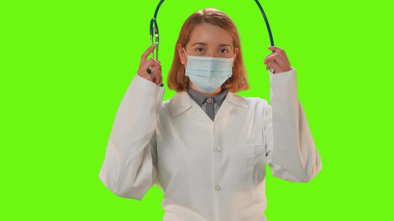 Download Stock Video Female Doctor With Mask On A Green Background Live Wallpaper For PC