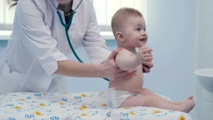 Stock Video Female Doctor Listening To A Baby With A Stethoscope Live Wallpaper For PC