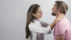 Stock Video Female Doctor Inspecting A Young Man Live Wallpaper For PC