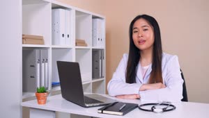 Stock Video Female Doctor In White Coat In Her Office Talking Live Wallpaper For PC