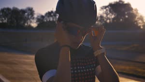 Stock Video Female Cyclist Putting On Sunglasses Before Training Live Wallpaper For PC