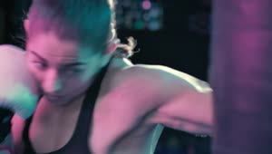 Stock Video Female Boxer Training With A Punching Bag Live Wallpaper For PC