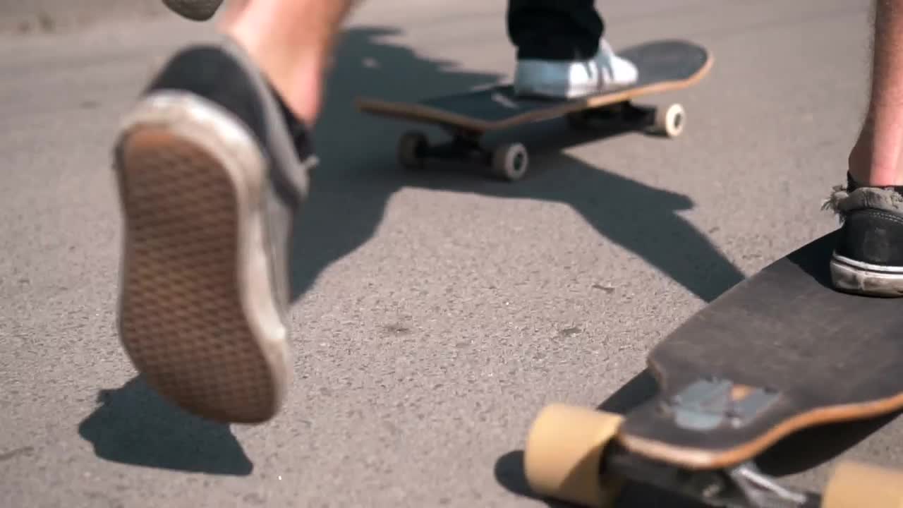 Download Stock Video Feet Of Skateboarders On The Street Tracking Shot Live Wallpaper For PC