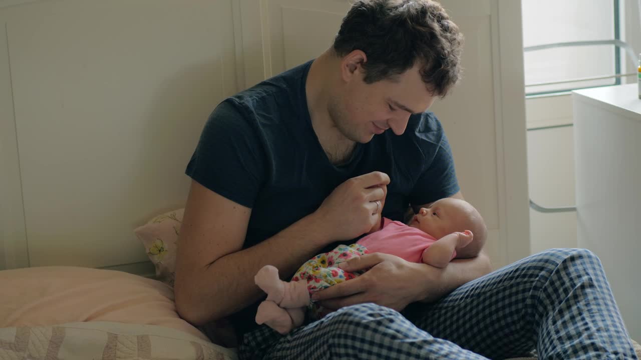 Download Stock Video Father Holding A Newborns Hand Live Wallpaper For PC