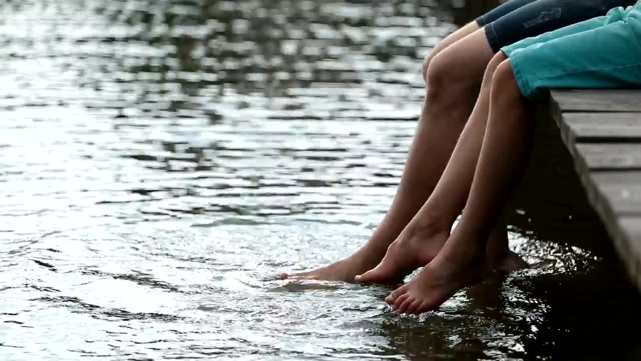 Download Stock Video Father And Son Sitting On A Pier Live Wallpaper For PC