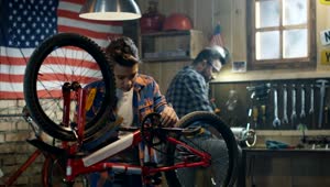 Stock Video Father And Son Repairing A Bike In The Garage Live Wallpaper For PC