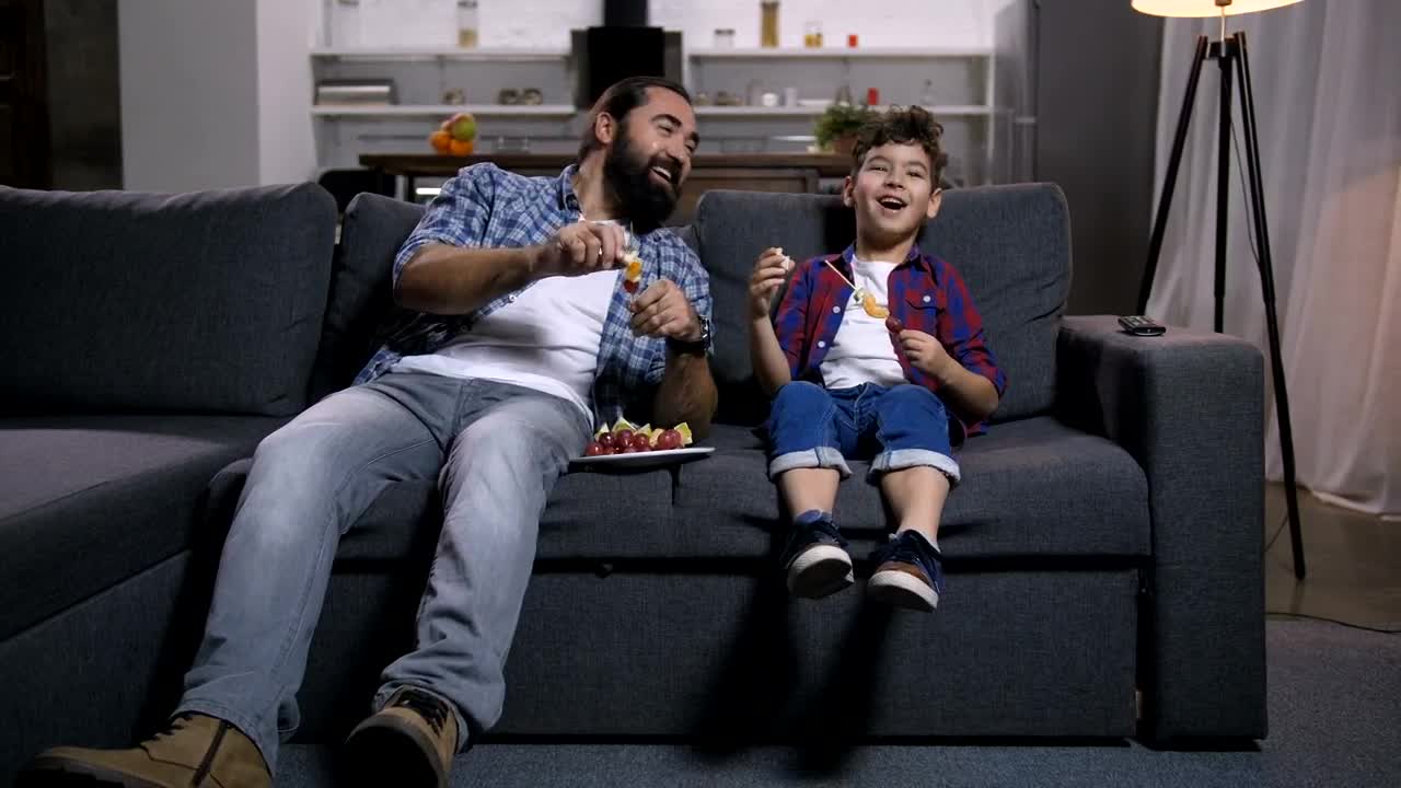 Download Stock Video Father And Son Laughing At The Tv Live Wallpaper For PC
