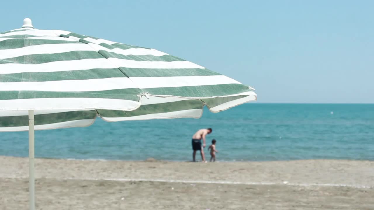 Download Stock Video Father And Son In The Distance On The Seashore Live Wallpaper For PC