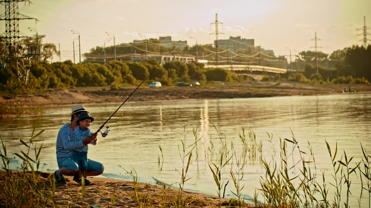 Download Stock Video Father And His Son Fishing On The Shore Of A Live Wallpaper For PC