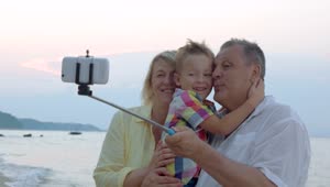 Stock Video Family Taking A Photo With A Selfie Stick Live Wallpaper For PC