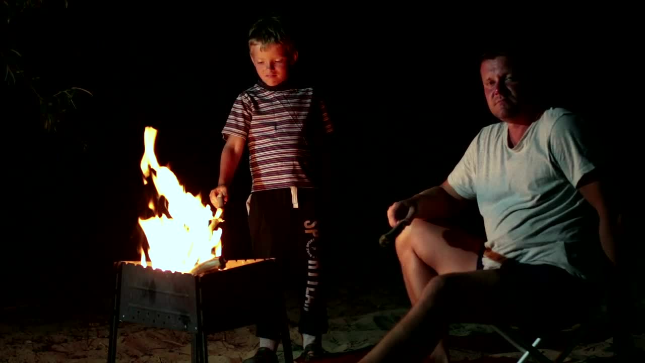 Download Stock Video Family Resting By A Campfire Live Wallpaper For PC