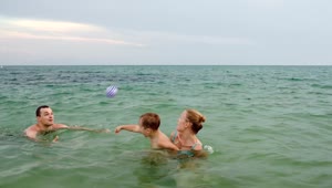 Stock Video Family Playing With A Ball In The Shore Live Wallpaper For PC