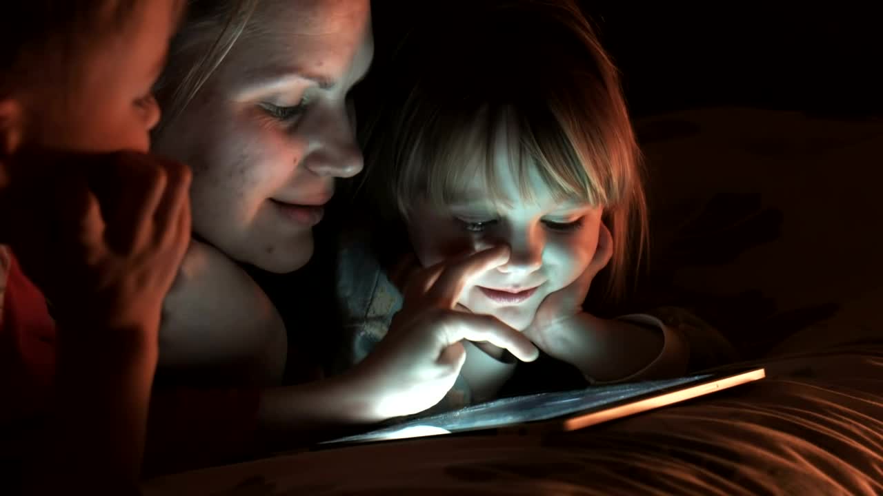 Download Stock Video Family Of Three Watching The Tablet In The Bedroom Live Wallpaper For PC