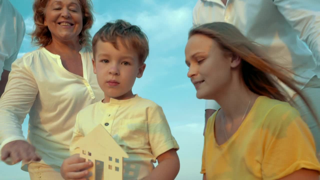 Download Stock Video Family Holding A Wooden House Live Wallpaper For PC