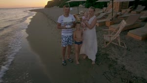 Stock Video Family Flying A Drone At The Beach Live Wallpaper For PC