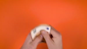 Stock Video Hands Full Of Money On An Orange Background Live Wallpaper For PC