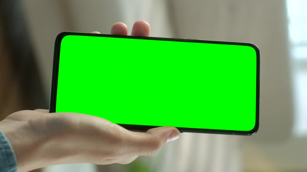 Download Stock Video Hand Showing A Cellphone With A Chroma Key Screen Live Wallpaper For PC