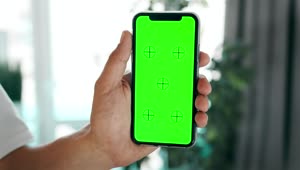 Stock Video Hand Holding Mobile Phone With Greenscreen Live Wallpaper For PC