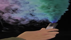 Stock Video Hand Holding A Multicolored Smoke Bomb Live Wallpaper For PC