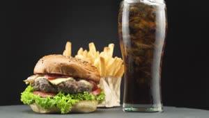 Stock Video Hamburger With Fries And A Soda On A Dark Background Live Wallpaper For PC