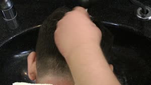 Stock Video Hairdresser Washing A Clients Hair Live Wallpaper For PC