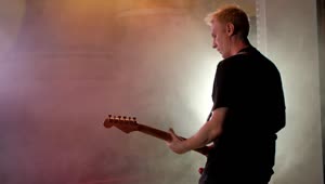 Stock Video Guitarist Playing Guitar On A Smoky Stage Live Wallpaper For PC