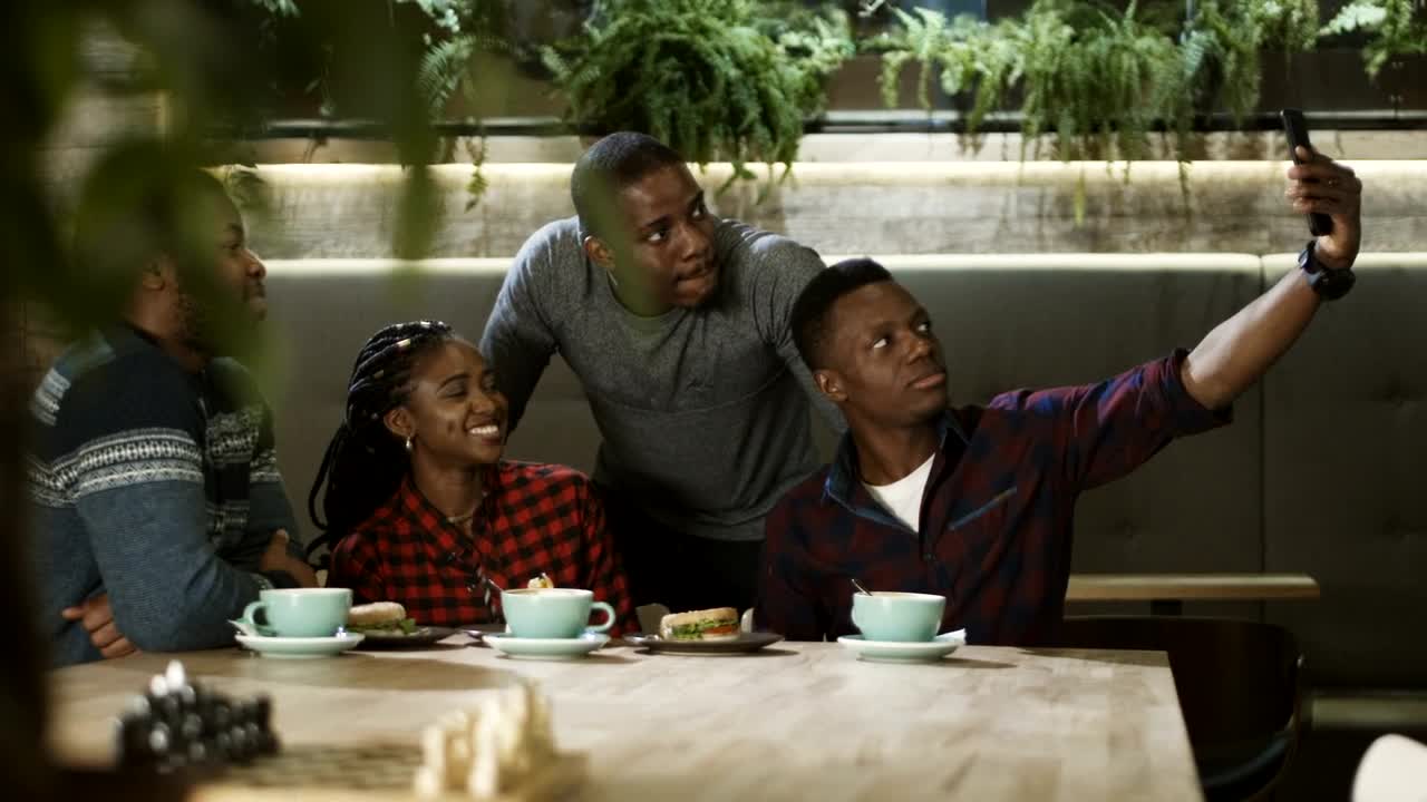 Download Stock Video Group Of Friends Taking Selfie In The Cafe Live Wallpaper For PC