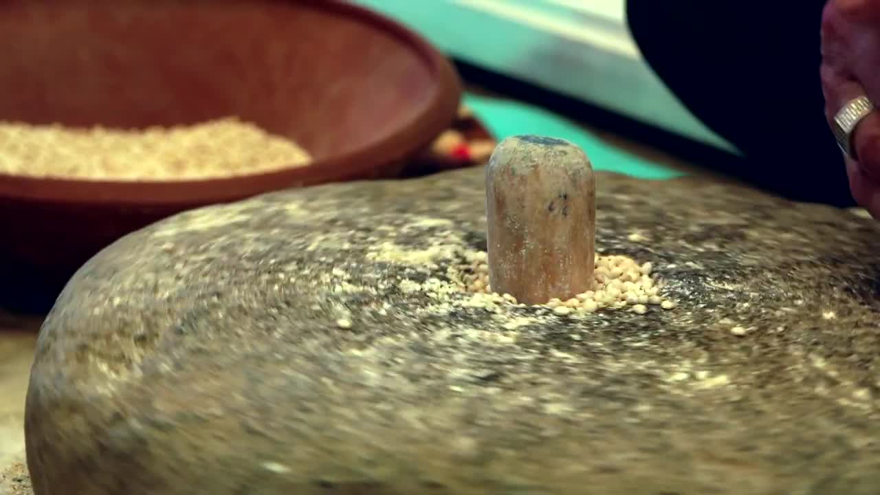 Download Stock Video Grinding Wheat With A Rotating Stone Live Wallpaper For PC