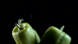 Stock Video Green Chili Peppers Being Wet On Black Background Live Wallpaper For PC
