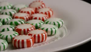 Stock Video Green And Red Candies Rotating On A White Plate Live Wallpaper For PC